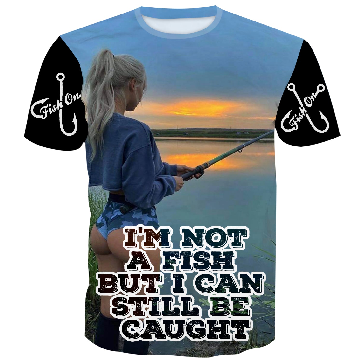 Confident woman  with fishing rod, wearing 'I'M NOT A FISH BUT I CAN STILL BE CAUGHT' shirt, standing by the water.